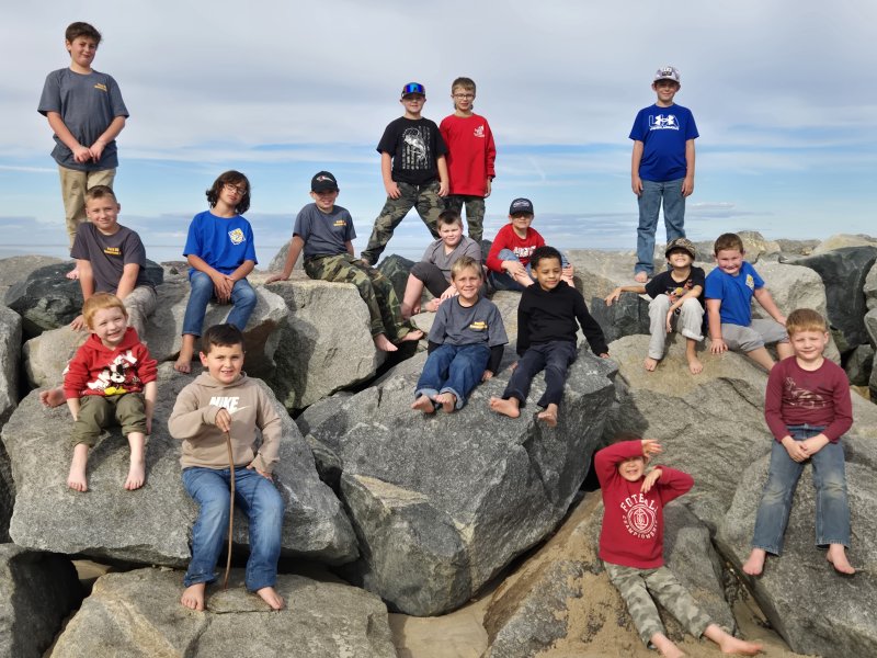 Gathered on the Herring Point jetty at Cape Henlopen State Park are in back Cub Scout Pack 95 members (l-r) Ryan Humble, Trenton Rathfon, Colin Ezell and Sawyer Barnes; third row Jack Simpson, Jareth Mihalics, Keller McCarty, David George and Greyson Dorey; second row Dylan Hershberger, Elijah Schrock, Luke Lewis, Keagan Clemons, Lucian Arias and Reid Goins. In front are Ridge Barnes and James Caraway. SUBMITTED PHOTO